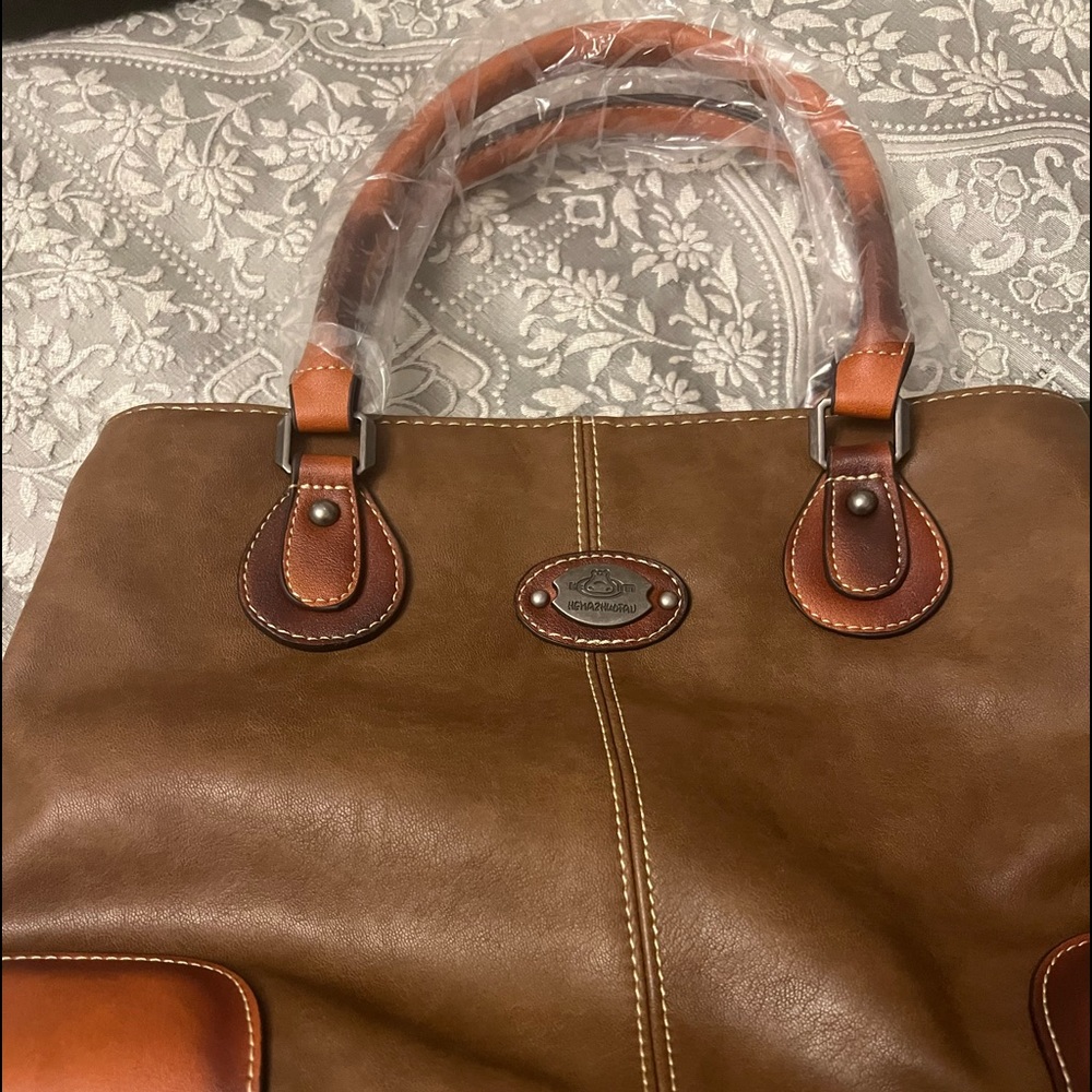 New brown bag.  I was given this and not familiar with the brand.  New
